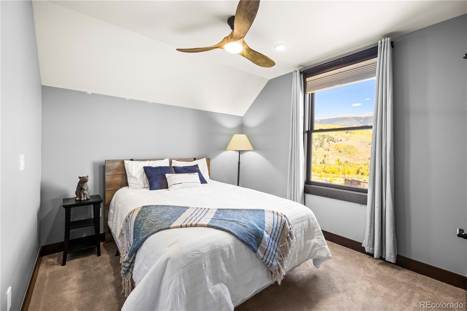 143 Beasley Road Silverthorne, CO 80498 - Photo 28 of 40 a bedroom with a bed and a window