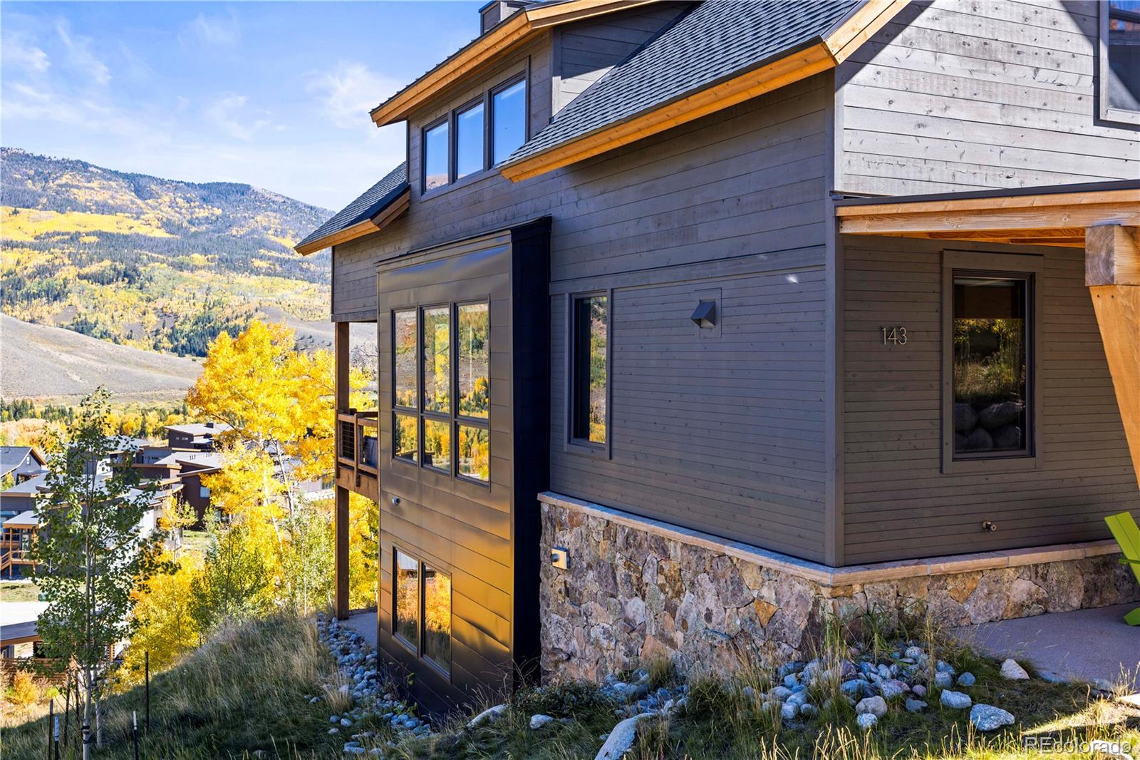 143 Beasley Road Silverthorne, CO 80498 - Photo 3 of 40 a view of a house with a flower garden