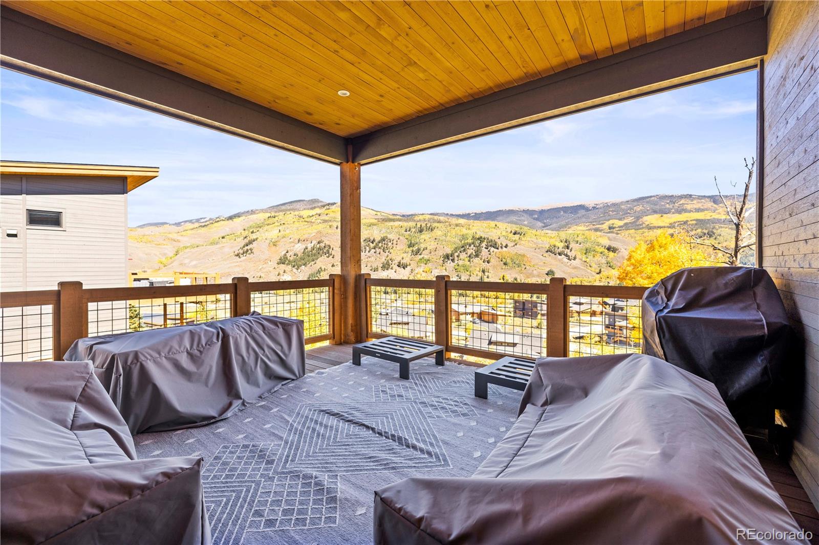 143 Beasley Road Silverthorne, CO 80498 - Photo 4 of 40 a living room with furniture and a floor to ceiling window