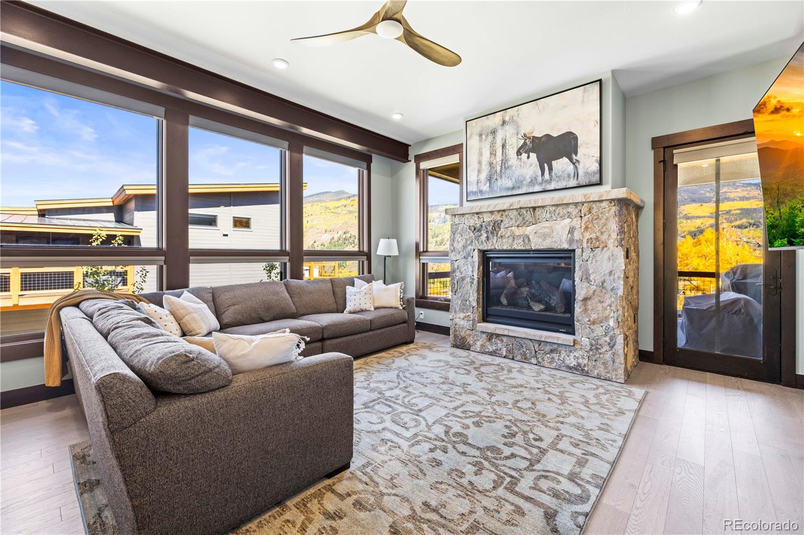 143 Beasley Road Silverthorne, CO 80498 - Photo 5 of 40 a living room with furniture and a fireplace