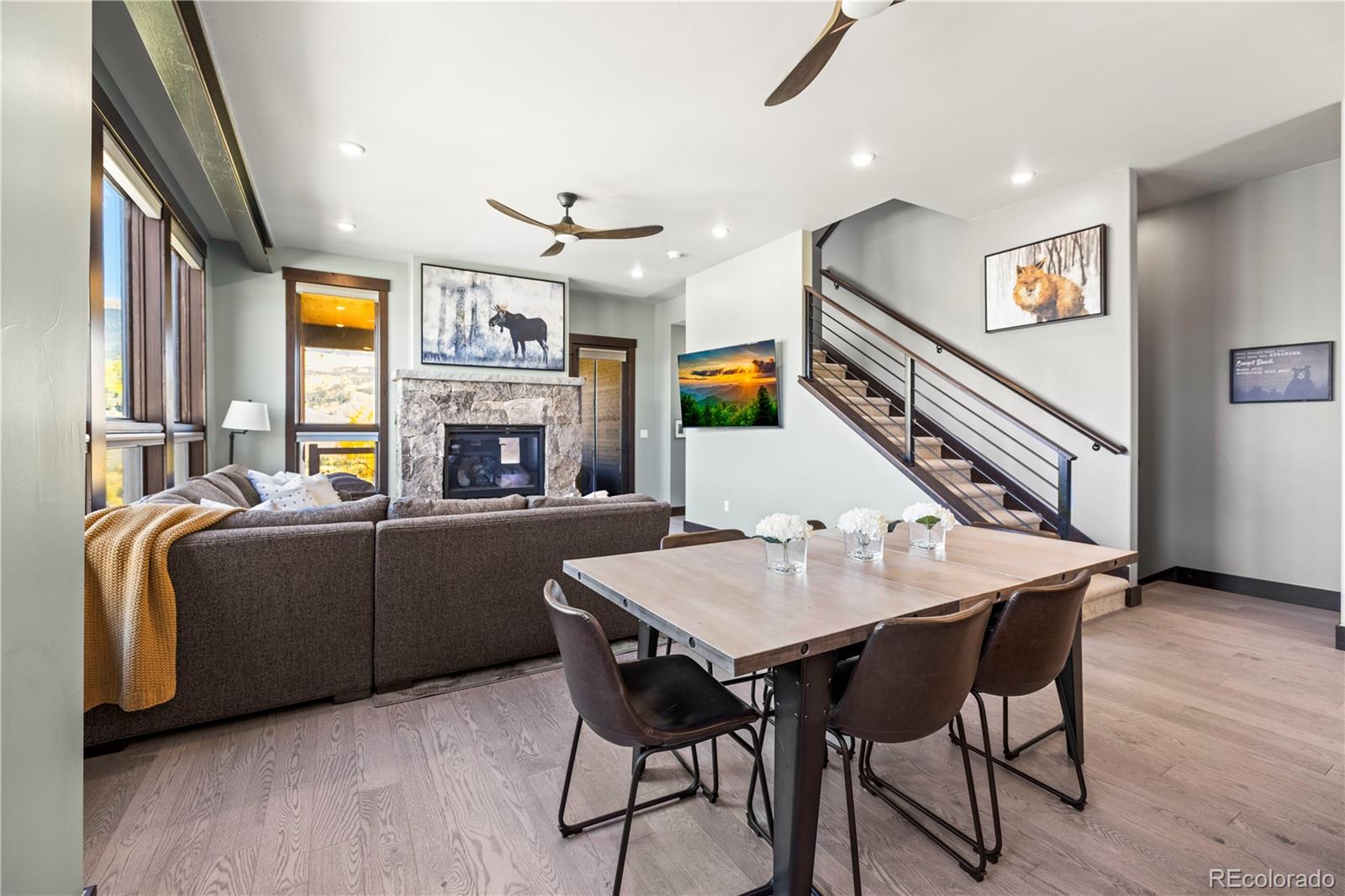 143 Beasley Road Silverthorne, CO 80498 - Photo 8 of 40 a living room with furniture a fireplace and a open kitchen view