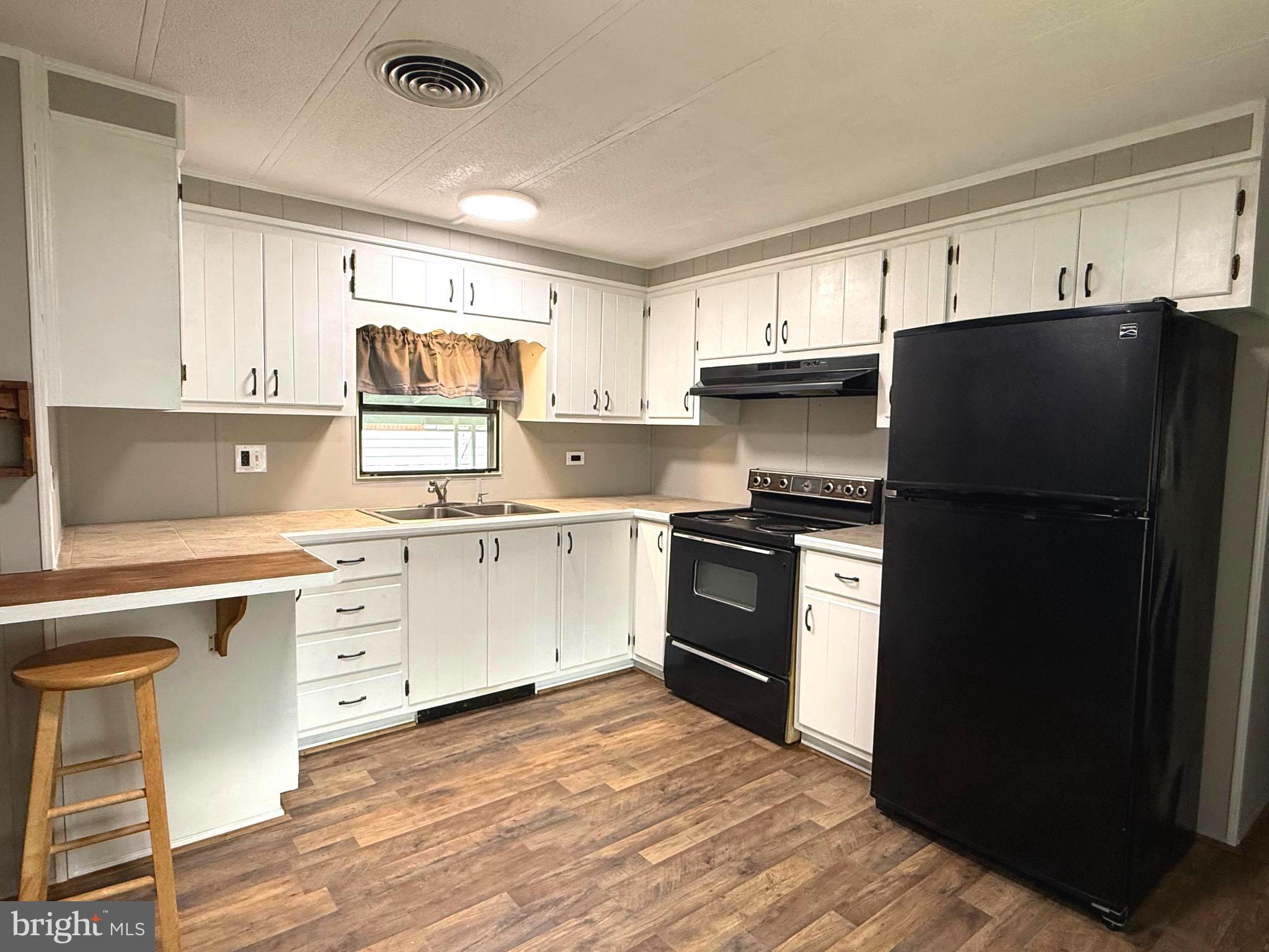 87 Holly Court Tabernacle, NJ 08088 - Photo 2 of 24 a kitchen with a refrigerator stove and sink