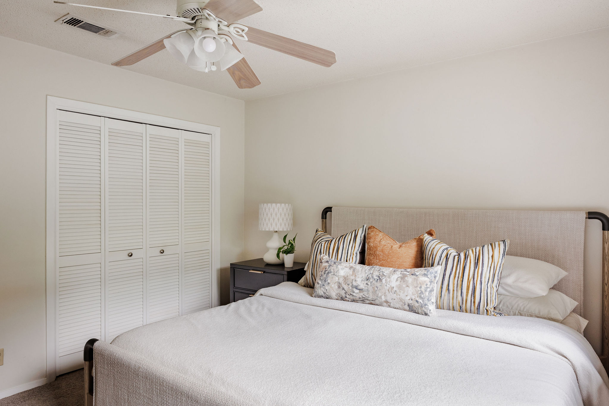2012 Cody Court Austin, TX 78704 - Photo 21 of 40 A well-lit bedroom provides comfort and storage with convenient closet access.