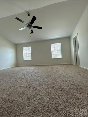 a view of a big room with carpet