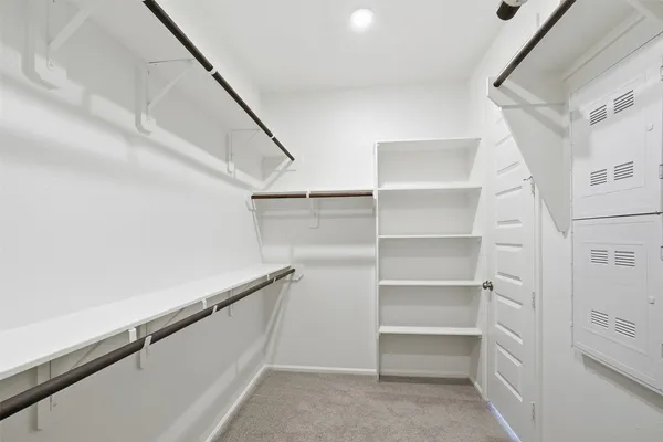 a view of an empty walk in closet