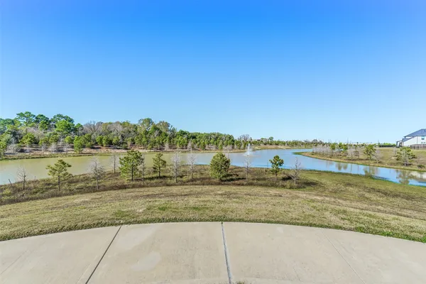 a view of a lake with a big yard