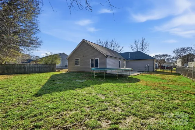 a front view of house with a garden