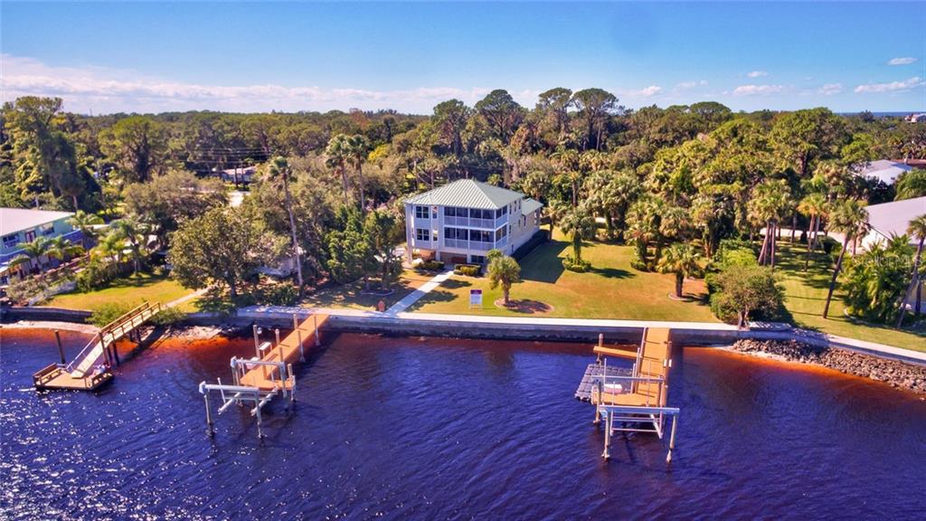 7814 Pier Road Port Richey, FL 34668 - Photo 1 of 1 Two lots (home sits on ONE & the other lot to R of home with lush tropical landscaping - both lots each with newer dock / lift / fish cleaning stations - electric and water) 165 + ft. of concrete seawall + concrete sidewalk reinforced. DEEP SAIL BOAT WATER - LARGE VESSEL navigation.