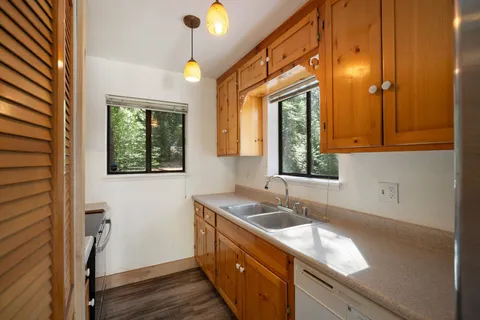 a kitchen with a sink and a window