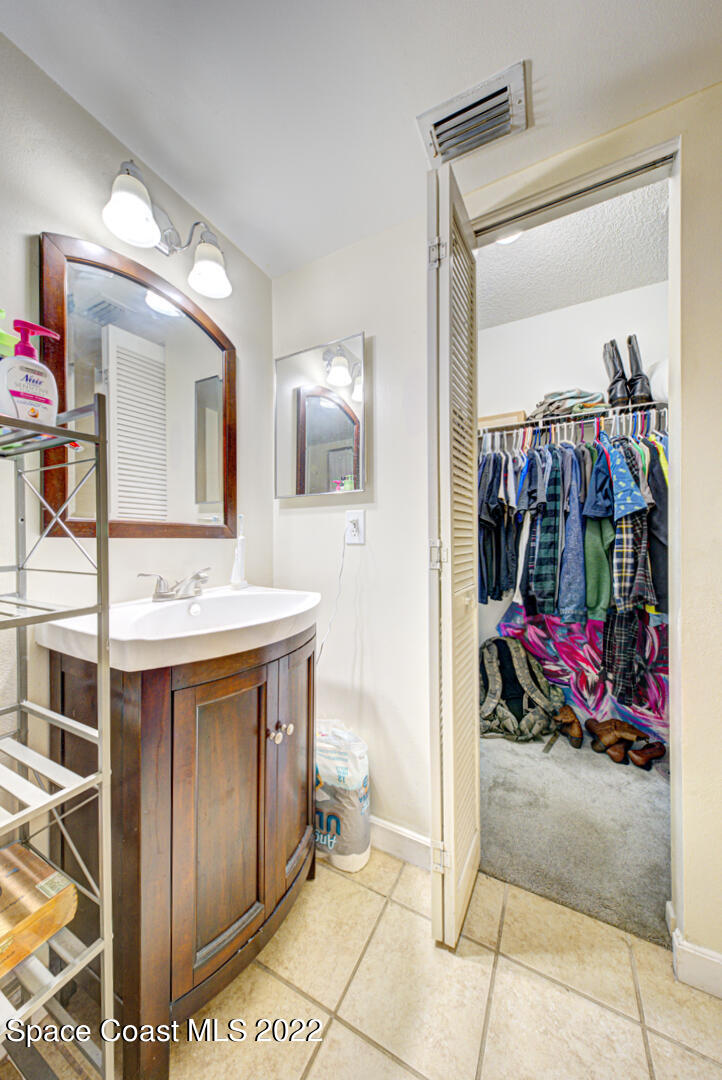 6457 Hunt Road Cocoa, FL 32927 - Photo 12 of 36 master bathroom vanity & closet