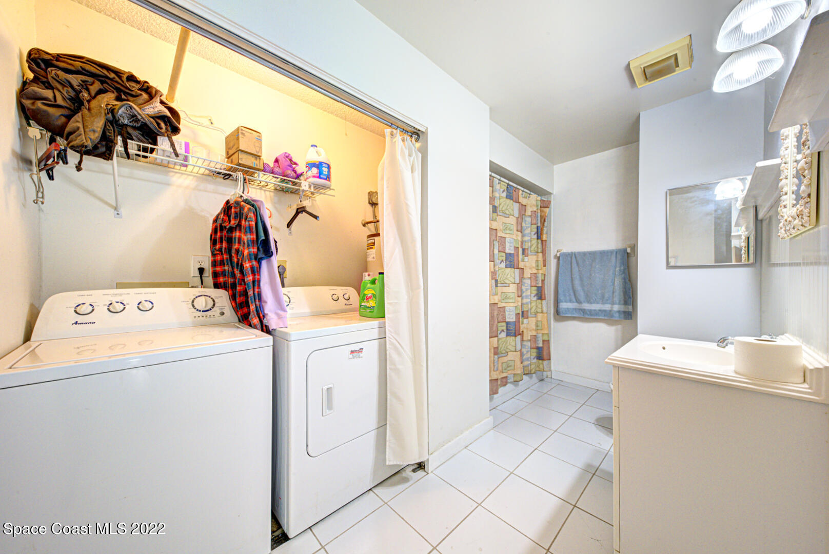 6457 Hunt Road Cocoa, FL 32927 - Photo 23 of 36 bathroom 2 & laundry closet