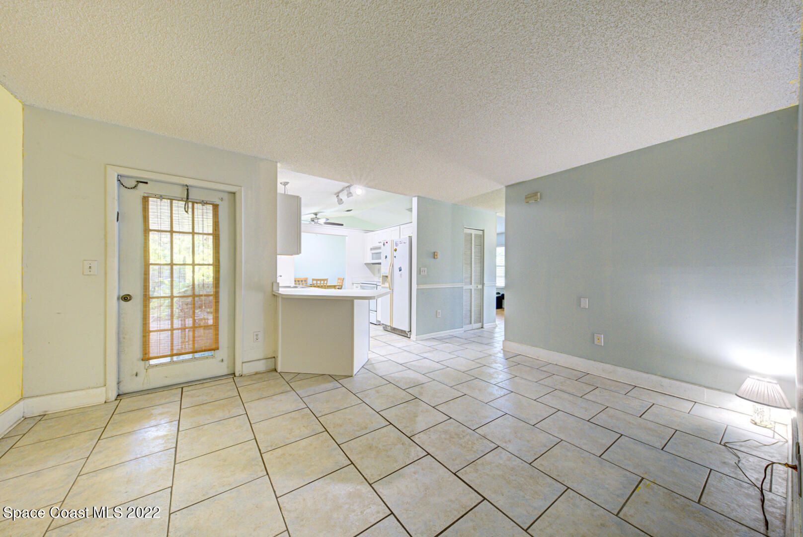 6457 Hunt Road Cocoa, FL 32927 - Photo 27 of 36 family room with door to porch