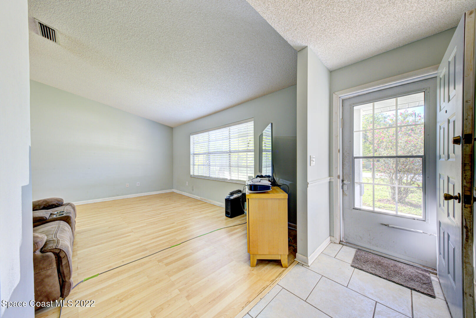 6457 Hunt Road Cocoa, FL 32927 - Photo 4 of 36 foyer & living room