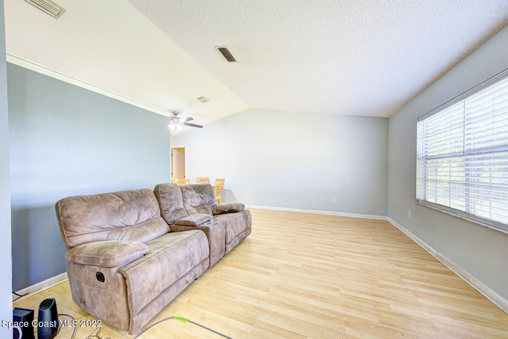6457 Hunt Road Cocoa, FL 32927 - Photo 6 of 36 living room with vaulted ceiling