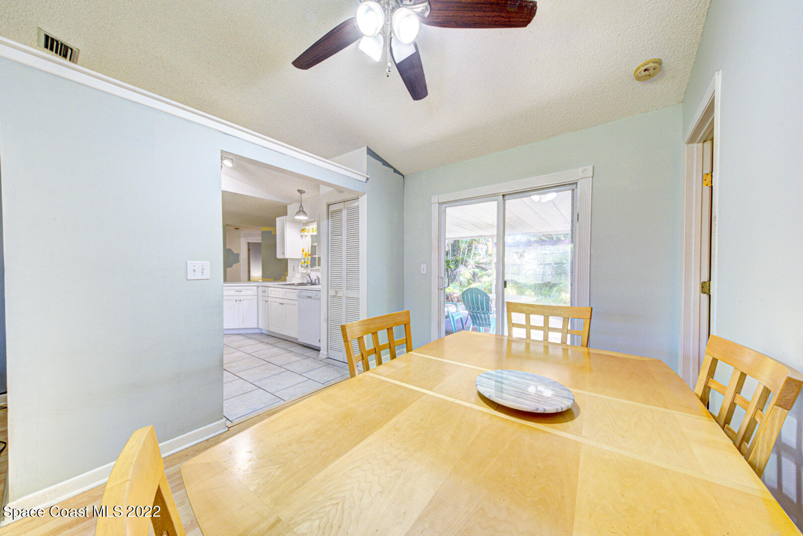 6457 Hunt Road Cocoa, FL 32927 - Photo 9 of 36 dining room with slider to porch