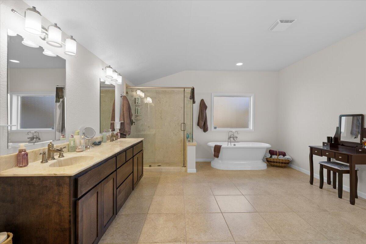 324 China Gulch Road Jacksonville, OR 97530 - Photo 24 of 45 a spacious bathroom with a double vanity sink and a mirror