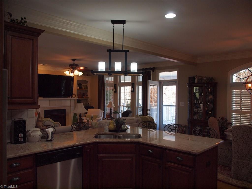 8413 Monticello Ridge Drive Rural Hall, NC 27045 - Photo 12 of 30 From kitchen looking out to living room and covered porch