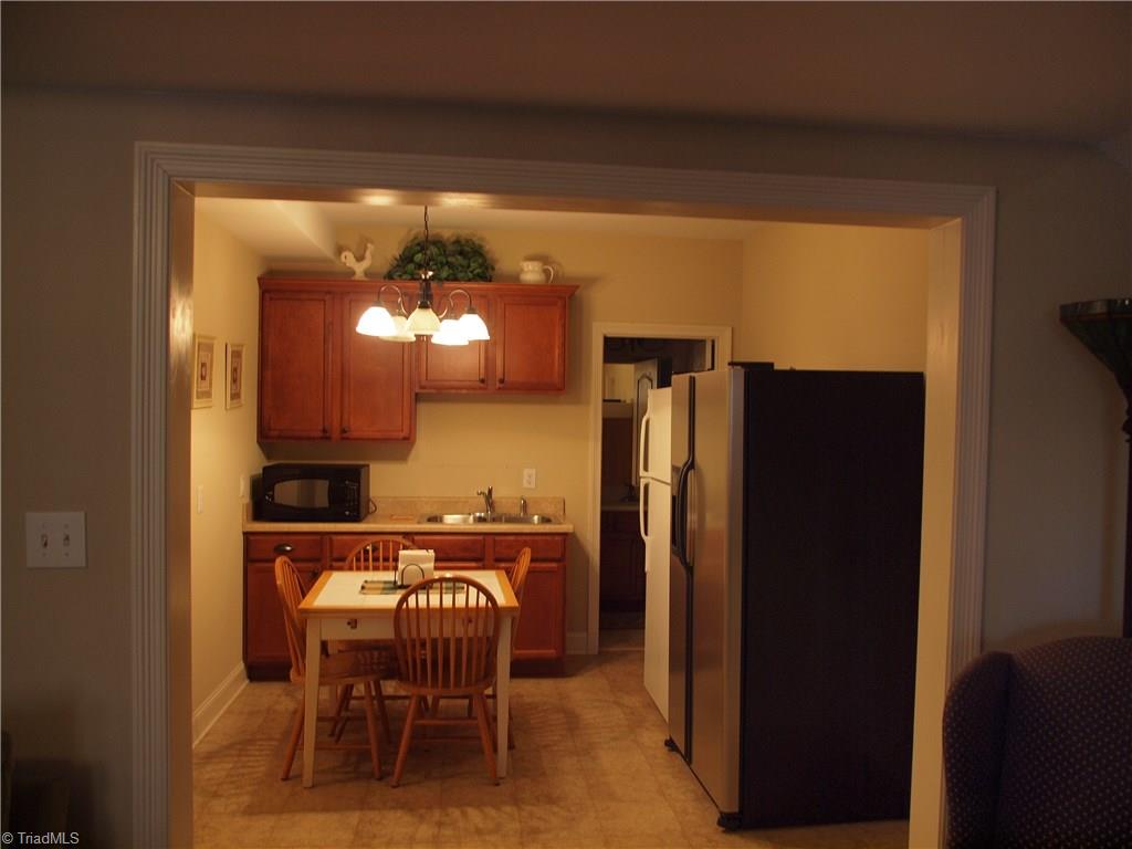 8413 Monticello Ridge Drive Rural Hall, NC 27045 - Photo 16 of 30 downstairs room looking towards kitchenette and half bath. not pictured is large closet under stairs