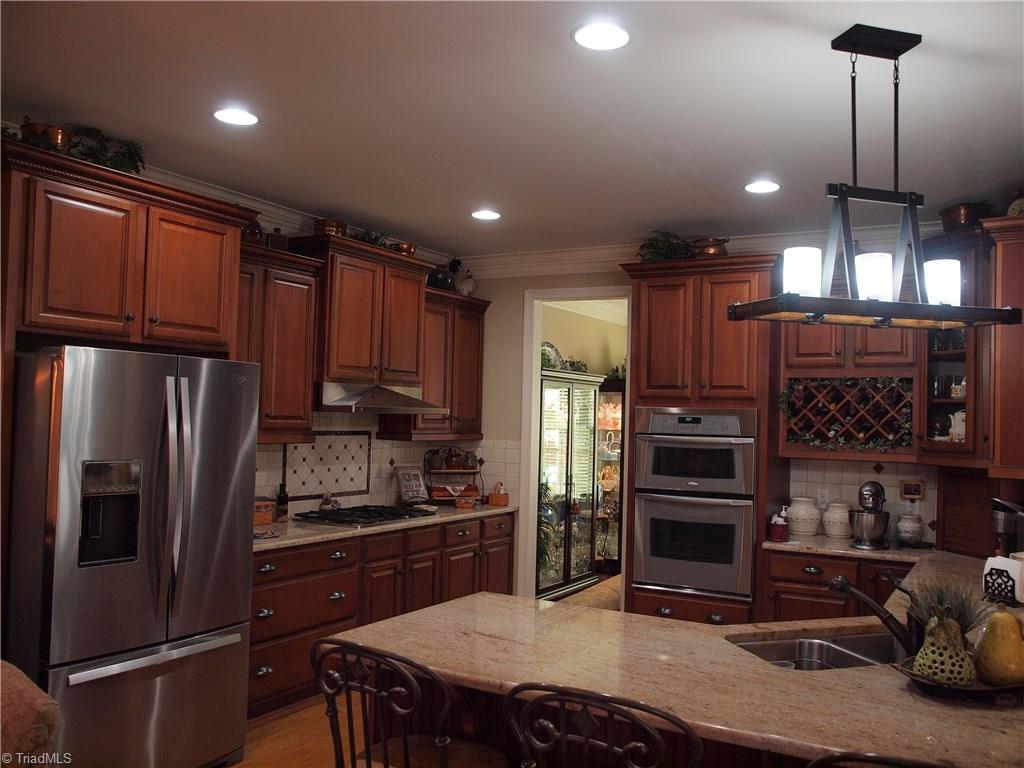 8413 Monticello Ridge Drive Rural Hall, NC 27045 - Photo 10 of 30 Large open kitchen with double oven and gas range