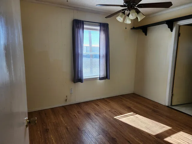 a bathroom with a granite countertop sink and washing machine
