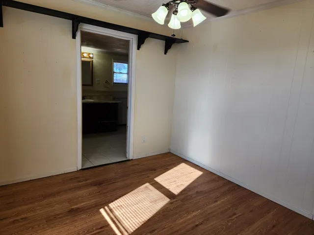 a bathroom with a shower and a sink