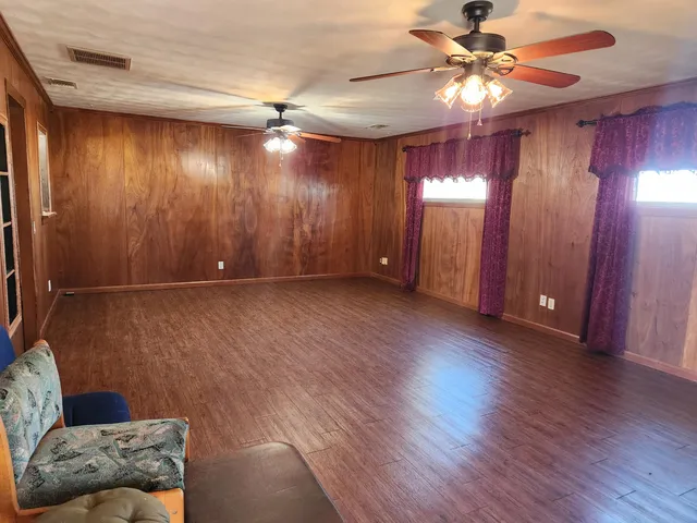 a view of livingroom with furniture and chandelier fan