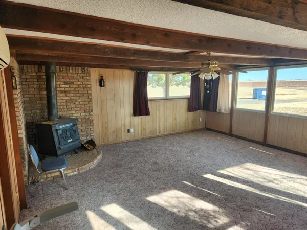 a view of empty room with floor to ceiling window