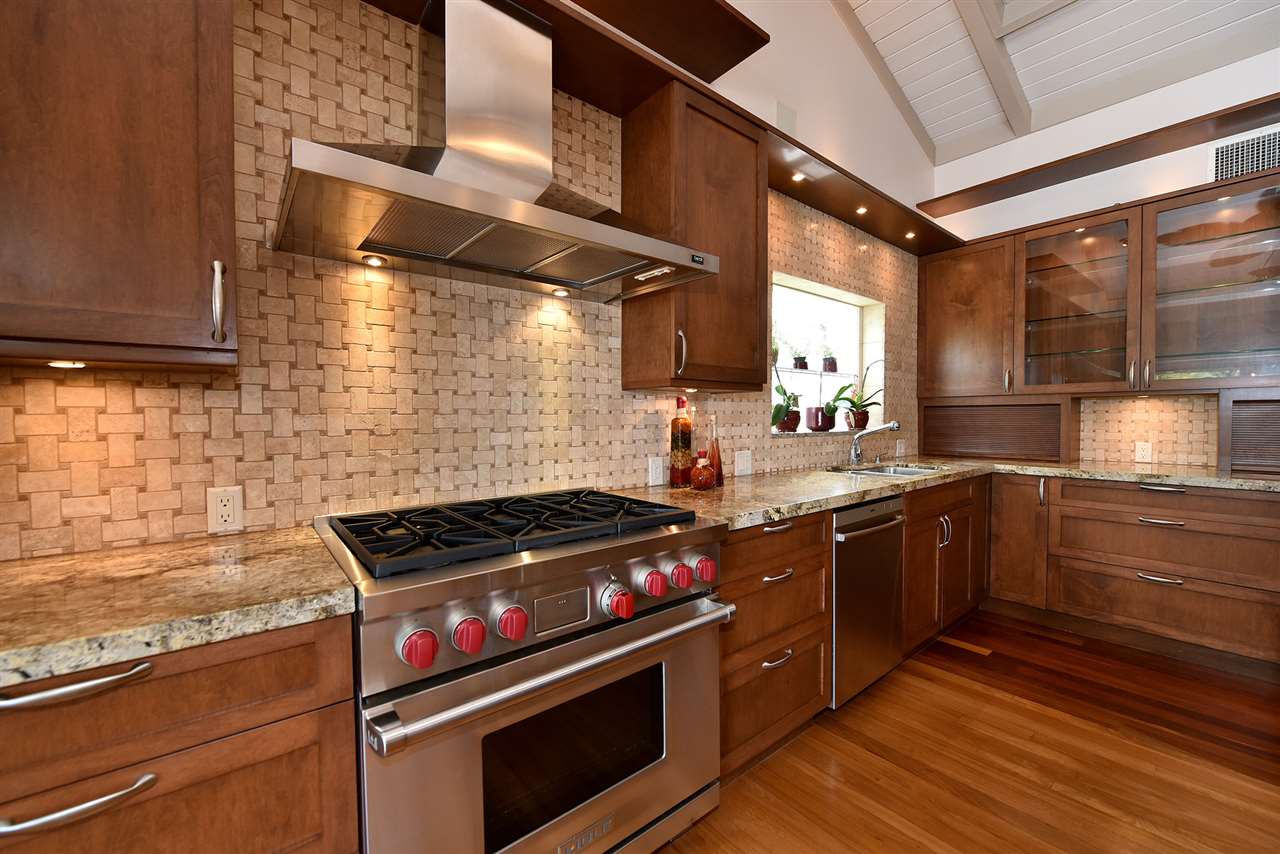 5045 Lower Honoapiilani Road, Unit HOUSE #5 Lahaina, HI 96761 - Photo 14 of 30 a kitchen with stainless steel appliances granite countertop a stove and a sink