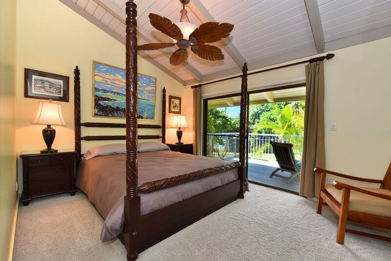 5045 Lower Honoapiilani Road, Unit HOUSE #5 Lahaina, HI 96761 - Photo 16 of 30 a bedroom with a bed and a large window