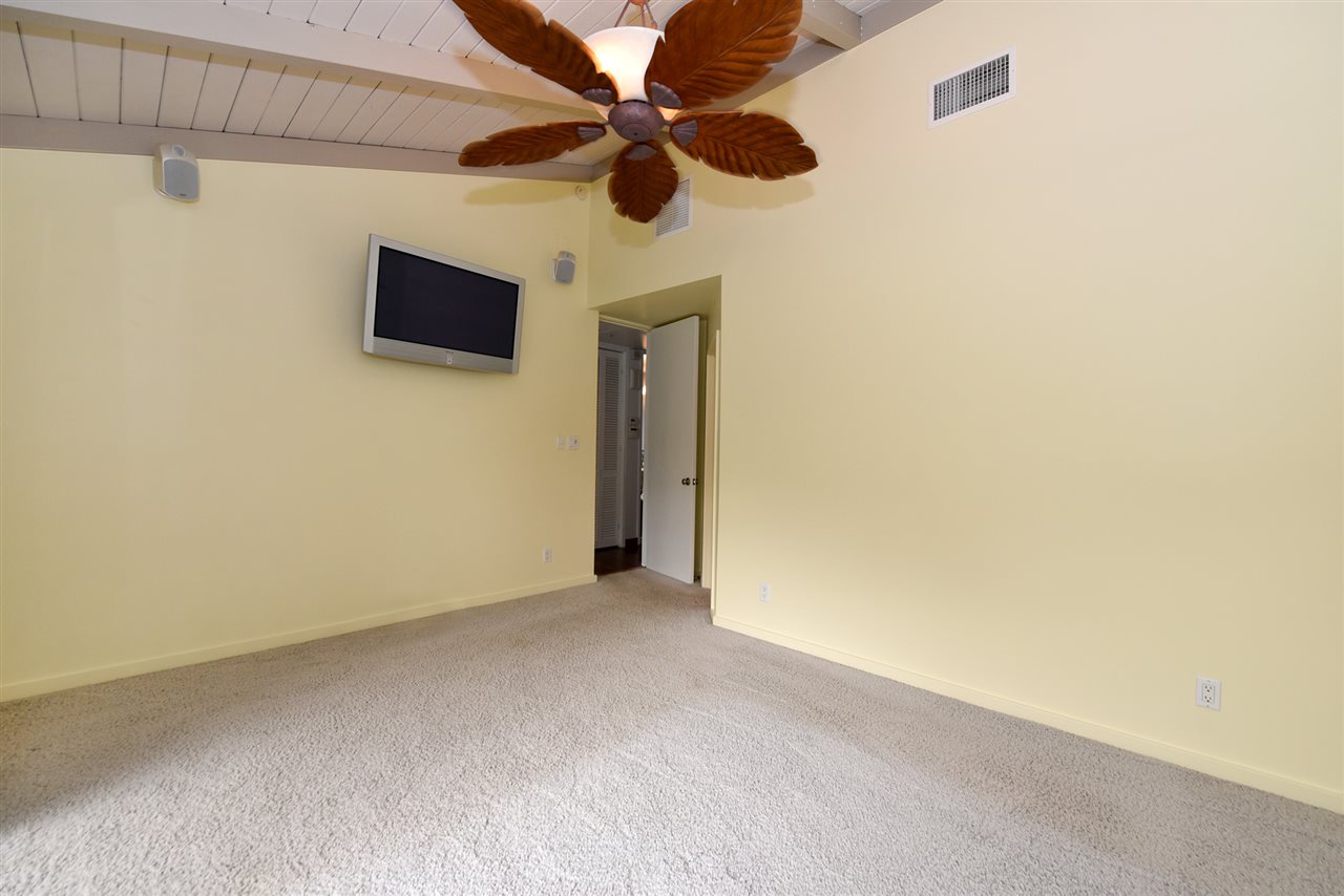 5045 Lower Honoapiilani Road, Unit HOUSE #5 Lahaina, HI 96761 - Photo 21 of 30 a view of an empty room with a ceiling fan