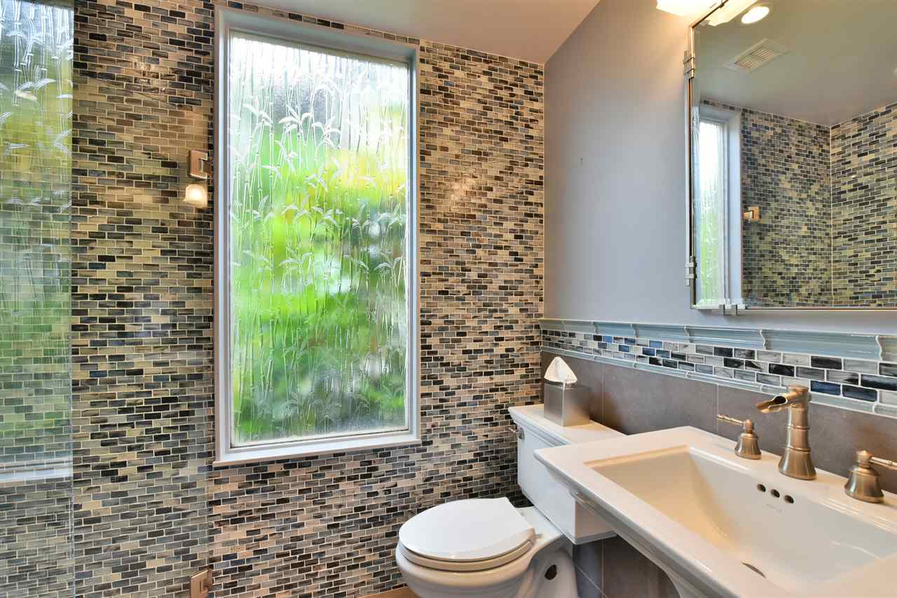 5045 Lower Honoapiilani Road, Unit HOUSE #5 Lahaina, HI 96761 - Photo 23 of 30 a bathroom with a sink toilet and shower