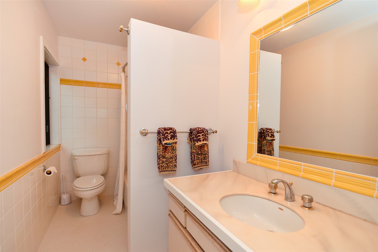 5045 Lower Honoapiilani Road, Unit HOUSE #5 Lahaina, HI 96761 - Photo 27 of 30 a bathroom with a sink toilet vanity and shower
