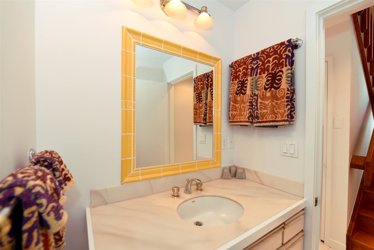 5045 Lower Honoapiilani Road, Unit HOUSE #5 Lahaina, HI 96761 - Photo 28 of 30 a bathroom with a sink and a mirror
