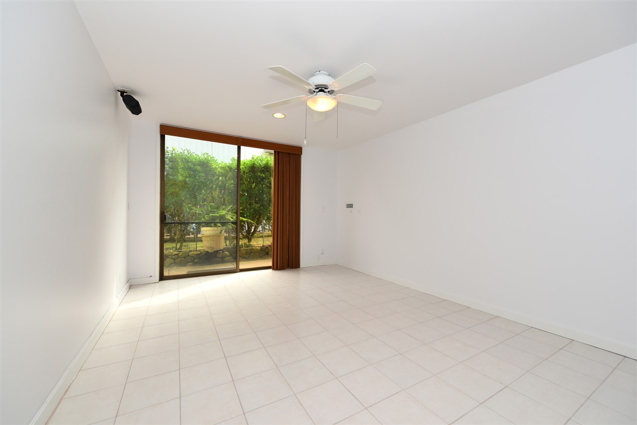 5045 Lower Honoapiilani Road, Unit HOUSE #5 Lahaina, HI 96761 - Photo 29 of 30 a view of a livingroom with a ceiling fan and window