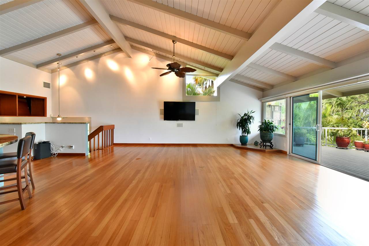 5045 Lower Honoapiilani Road, Unit HOUSE #5 Lahaina, HI 96761 - Photo 5 of 30 a view of a livingroom with furniture and wooden floor