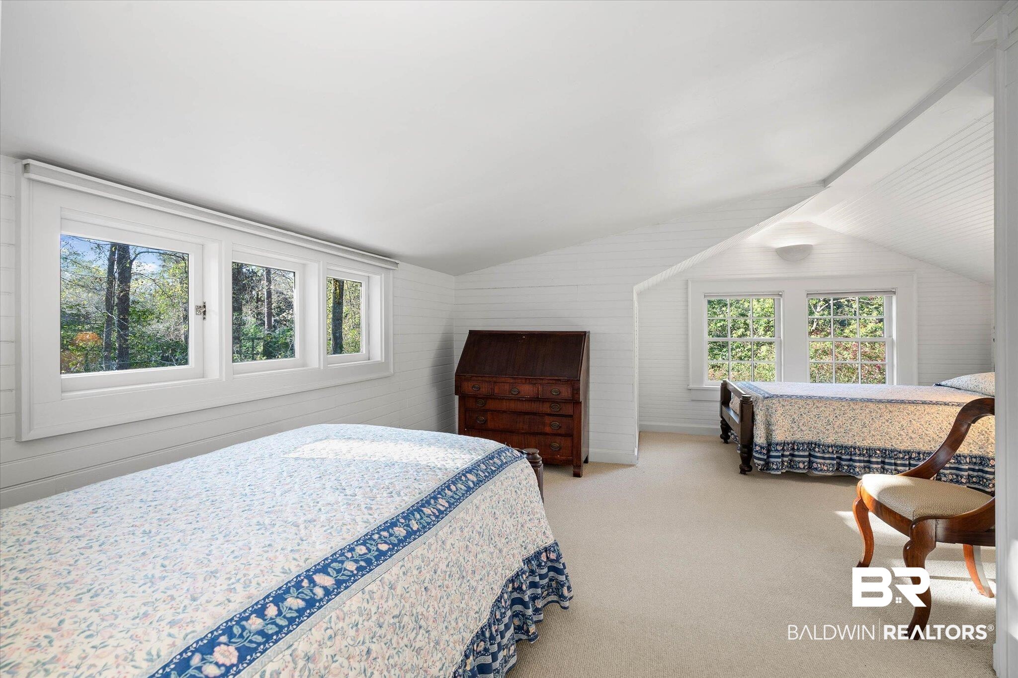 2 Westgate Road Mobile, AL 36608 - Photo 34 of 63 Bedroom with vaulted ceiling, light carpet, and wood walls