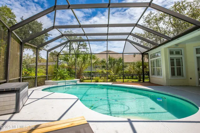 a view of a swimming pool with a backyard