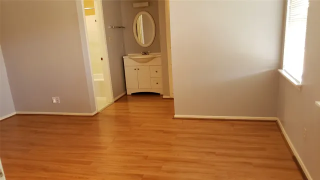 a view of a storage & utility room with wooden floor