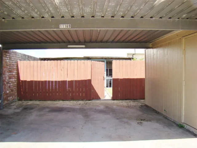 a view of entryway with wooden walls
