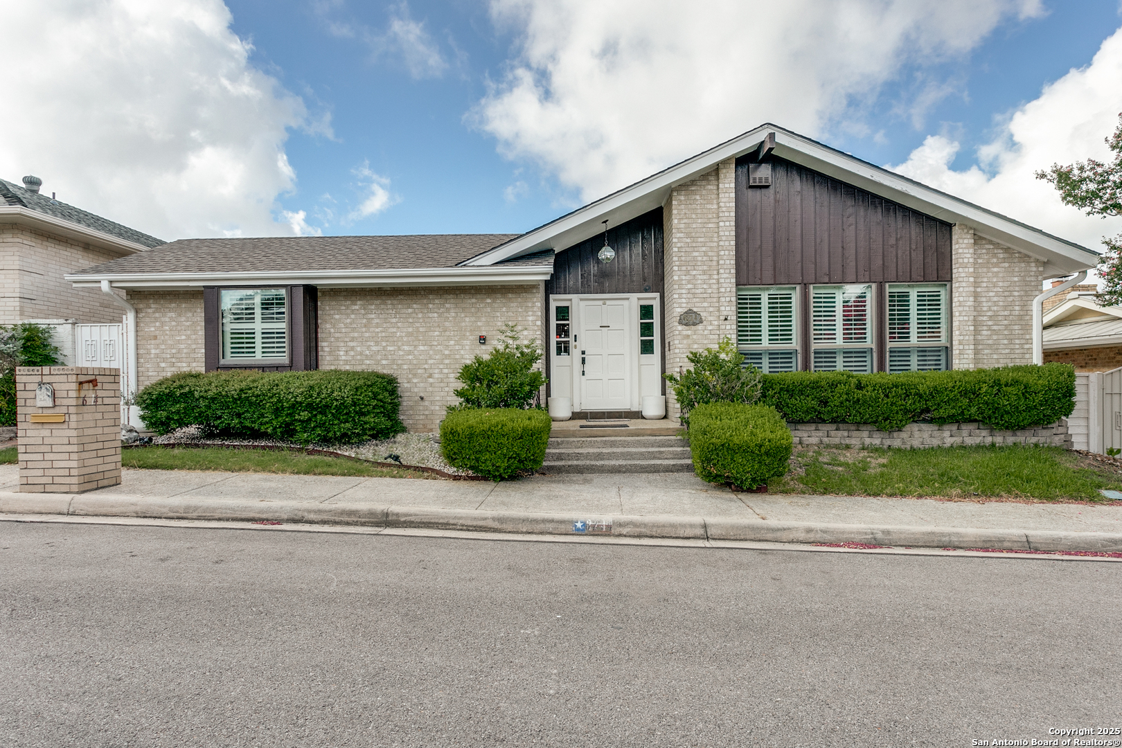 6214 Spindrift Windcrest, TX 78239 - Photo 1 of 1 a front view of house with garage and plants