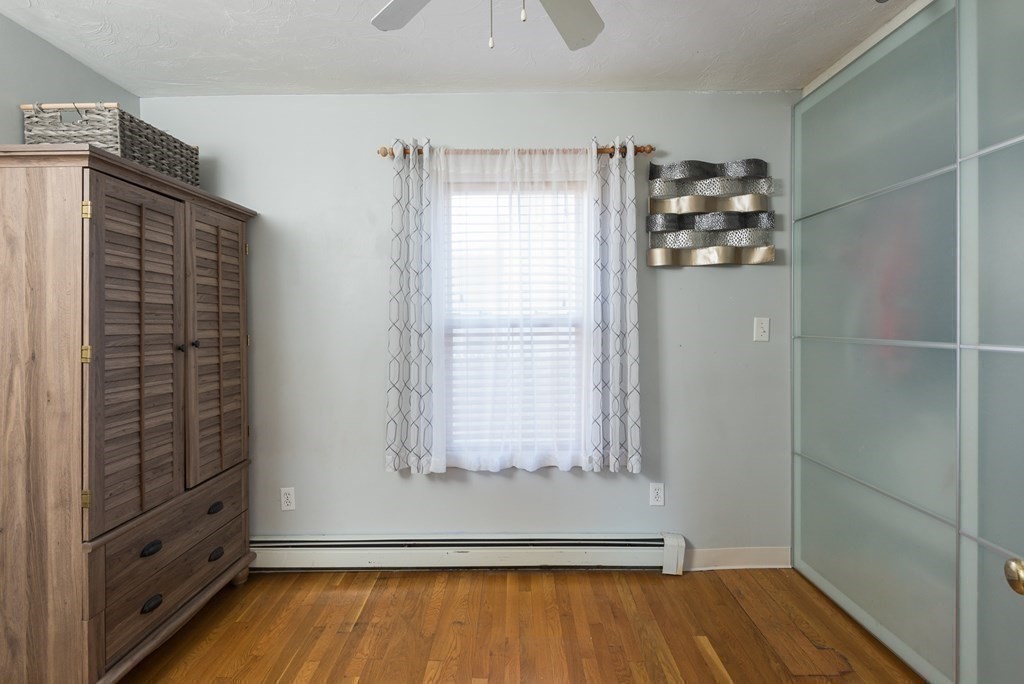 14 Sumner Street Taunton, MA 02780 - Photo 11 of 22 a view of empty room with wooden floor and fan