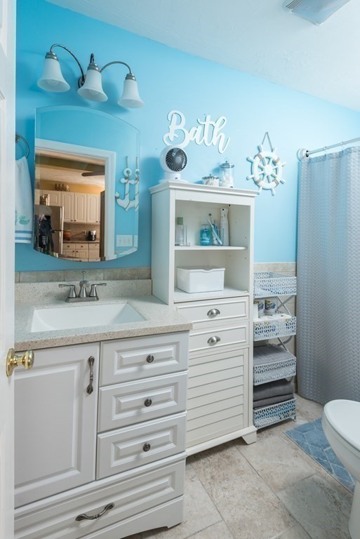 14 Sumner Street Taunton, MA 02780 - Photo 12 of 22 a bathroom with a double vanity sink and a mirror