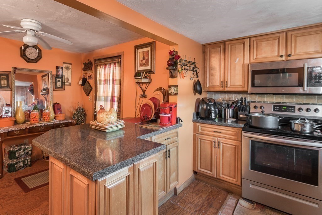 14 Sumner Street Taunton, MA 02780 - Photo 13 of 22 a kitchen with stainless steel appliances granite countertop a sink a stove and cabinets