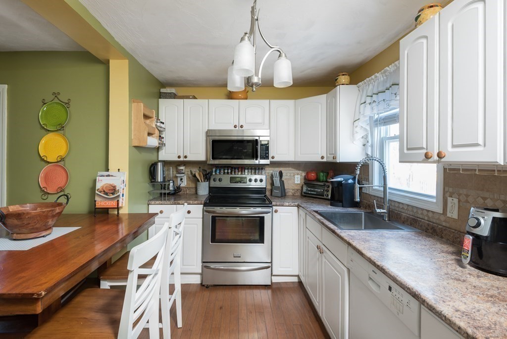 14 Sumner Street Taunton, MA 02780 - Photo 5 of 22 a kitchen with a sink stainless steel appliances and cabinets