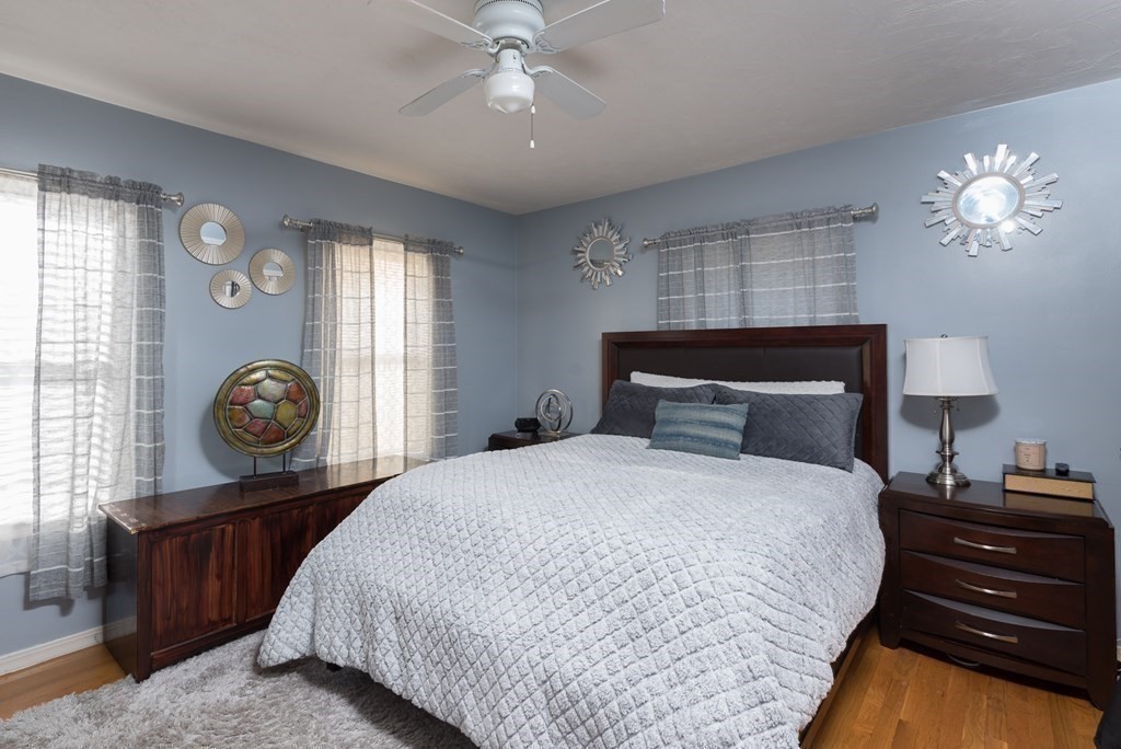 14 Sumner Street Taunton, MA 02780 - Photo 9 of 22 a bedroom with a bed and a chandelier