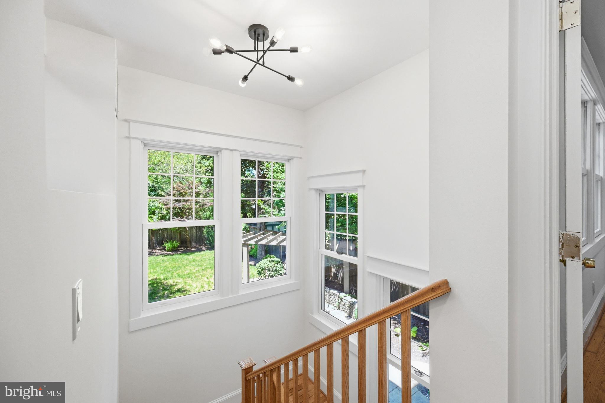 3707 Military Road Northwest Washington, DC 20015 - Photo 38 of 57 Open sunny staircase from kitchen to basement