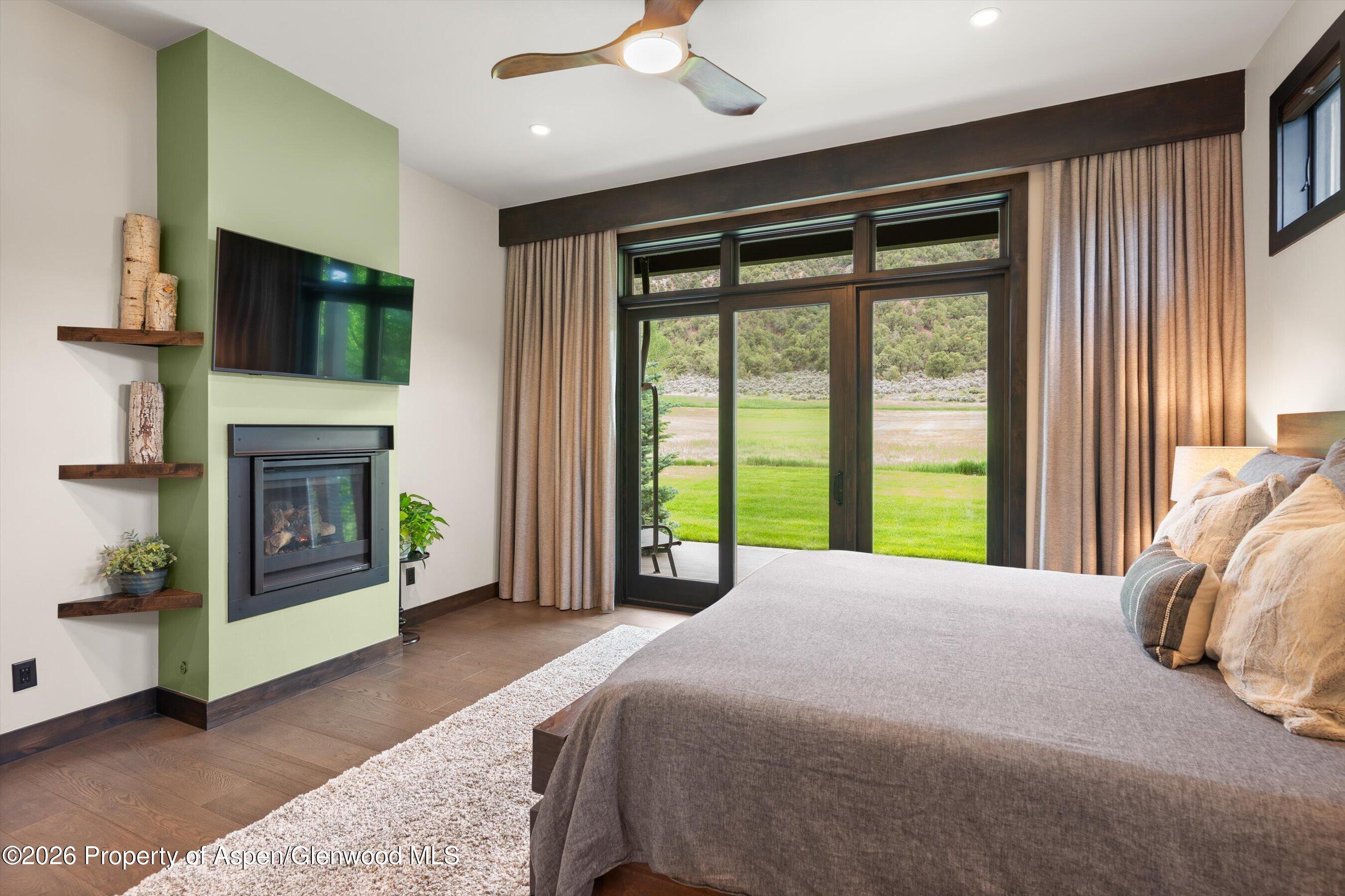 285 Saddleback Road Carbondale, CO 81623 - Photo 21 of 55 Primary bedroom with fireplace
