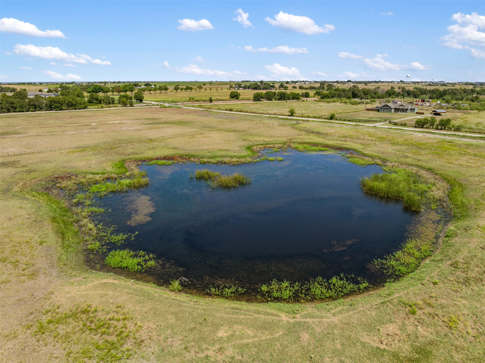 -littig Rd Littig Road Elgin, TX 78621 - Photo 22 of 37 Aerial view of sparsely populated area featuring a large body of water