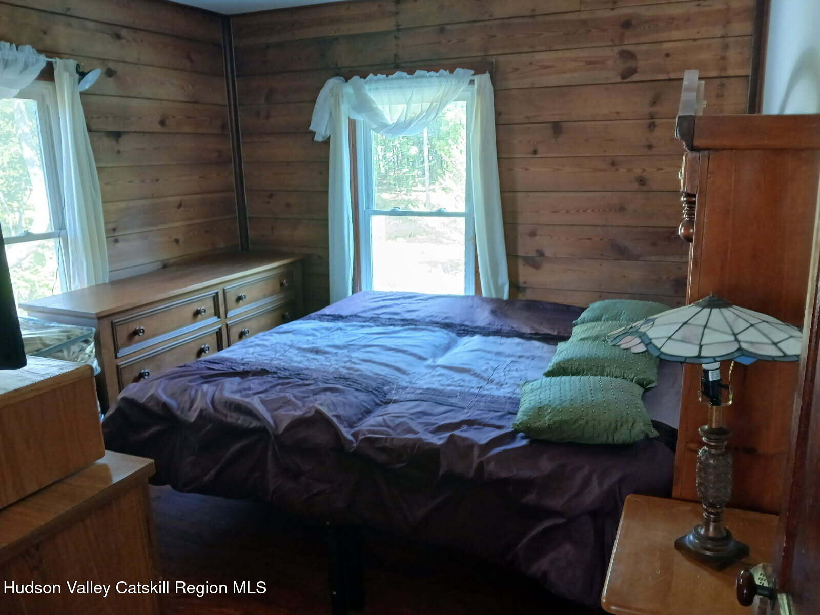 311 North Lake Road Haines Falls, NY 12436 - Photo 18 of 34 a bedroom with a bed dresser and a window