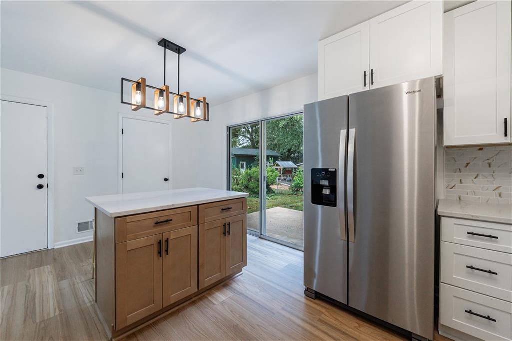 4360 Sasanqua Court Tucker, GA 30084 - Photo 12 of 37 a kitchen with stainless steel appliances a refrigerator and a stove
